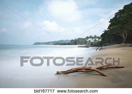 Ocean waves on sandy beach View Large Photo Image Stock Photo - Ocean waves on sandy beach. Fotosearch