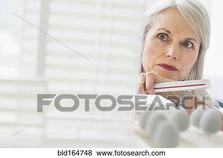 Older Caucasian architect examining scale model in office View Large Photo Image Stock Photo - Older Caucasian architect examining scale model in office. Fotosearch