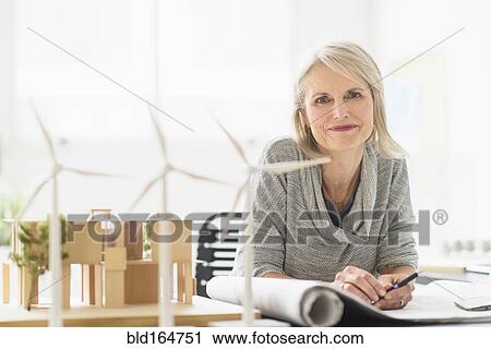 Older Caucasian architect sitting in office View Large Photo Image Stock Image - Older Caucasian architect sitting in office. Fotosearch