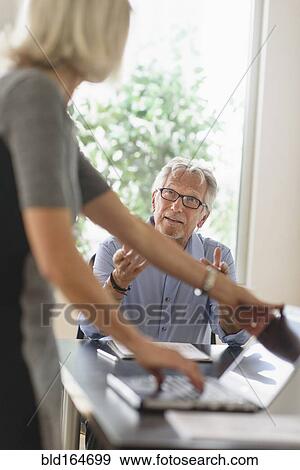 Older Caucasian business people arguing in office meeting View Large Photo Image Stock Photo - Older Caucasian business people arguing in office meeting. Fotosearch