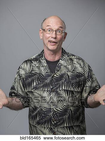 Stock Photography - Older Caucasian man shrugging. Fotosearch