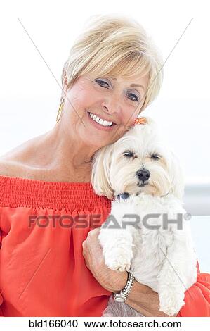 Older Caucasian woman hugging dog View Large Photo Image Stock Image - Older Caucasian woman hugging dog. Fotosearch