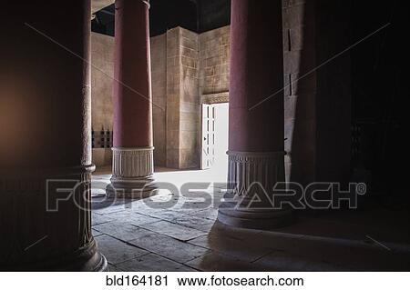 Stock Image - Open door and pillars in ancient building. Fotosearch