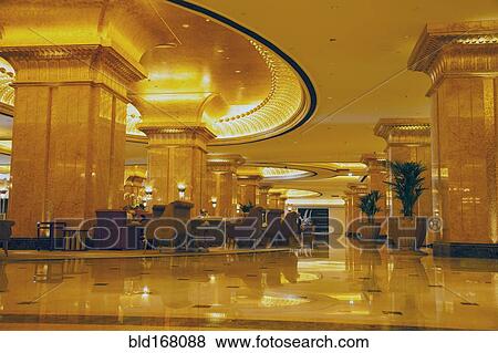 Stock Photo - Ornate domes and tower under cloudy sky, Abu Dhabi, Abu Dhabi Emirate, United Arab Emirates. Fotosearch