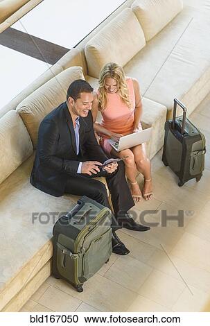 Overhead view of business people talking in lobby View Large Photo Image Stock Image - Overhead view of business people talking in lobby. Fotosearch