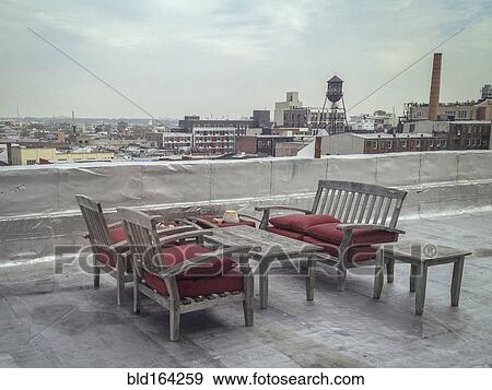 Patio furniture on urban rooftop View Large Photo Image Stock Photo - Patio furniture on urban rooftop. Fotosearch