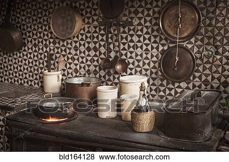 Pots and pans on cast iron stove in kitchen View Large Photo Image Stock Photo - Pots and pans on cast iron stove in kitchen. Fotosearch