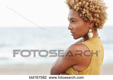 Profile of pensive Black woman at beach View Large Photo Image Stock Image - Profile of pensive Black woman at beach. Fotosearch