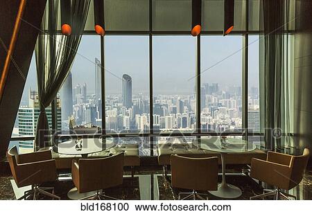 Restaurant tables overlooking Abu Dhabi cityscape, Abu Dhabi Emirate, United Arab Emirates View Large Photo Image Stock Image - Restaurant tables overlooking Abu Dhabi cityscape, Abu Dhabi Emirate, United Arab Emirates. Fotosearch