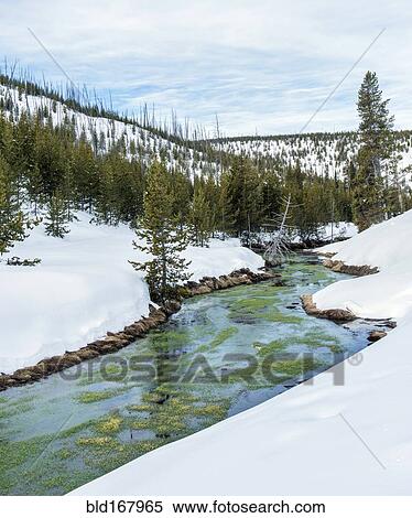 Stock Photography - River and snowy hills in remote landscaper. Fotosearch