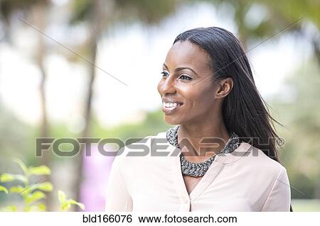 Smiling African American businesswoman standing outdoors View Large Photo Image Stock Photograph - Smiling African American businesswoman standing outdoors. Fotosearch