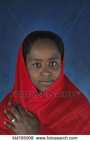 Smiling Black girl wearing headscarf View Large Photo Image Stock Photo - Smiling Black girl wearing headscarf. Fotosearch