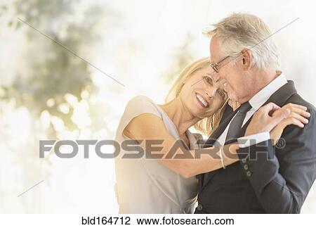 Smiling older Caucasian couple dancing View Large Photo Image Stock Image - Smiling older Caucasian couple dancing. Fotosearch