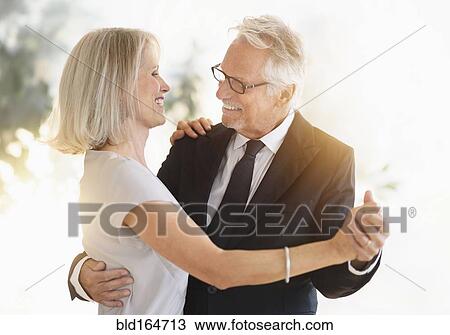 Smiling older Caucasian couple dancing View Large Photo Image Stock Image - Smiling older Caucasian couple dancing. Fotosearch