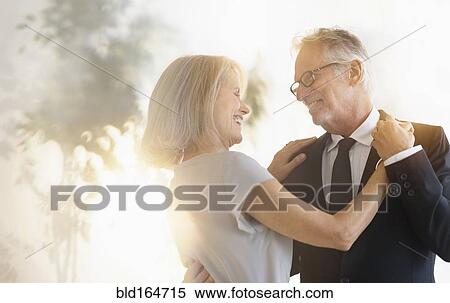 Smiling older Caucasian couple dancing View Large Photo Image Stock Photography - Smiling older Caucasian couple dancing. Fotosearch