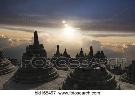 Spires on Temple of Borobudur at sunset, Borobudur, Indonesia View Large Photo Image Stock Photo - Spires on Temple of Borobudur at sunset, Borobudur, Indonesia. Fotosearch