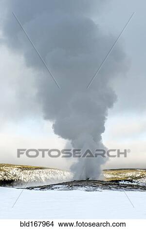 Steam rising from Old Faithful geyser, Yellowstone, Wyoming, United States View Large Photo Image Picture - Steam rising from Old Faithful geyser, Yellowstone, Wyoming, United States. Fotosearch