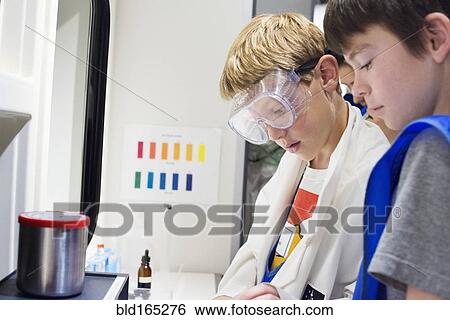 Students working together in science lab View Large Photo Image Stock Photograph - Students working together in science lab. Fotosearch