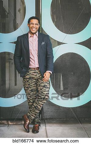 Picture - Stylish Mixed race businessman smiling outdoors. Fotosearch