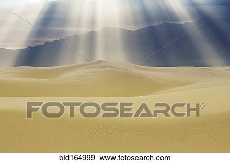Sunbeams over sand dunes, White Sands National Monument, New Mexico, United States View Large Photo Image Stock Photo - Sunbeams over sand dunes, White Sands National Monument, New Mexico, United States. Fotosearch