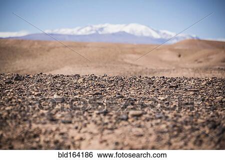 Stock Photograph - Surface level view of gravel field and remote desert. Fotosearch