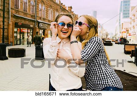 Women making faces in city View Large Photo Image Stock Image - Women making faces in city. Fotosearch