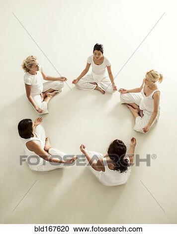 Women meditating in yoga class View Large Photo Image Stock Image - Women meditating in yoga class. Fotosearch