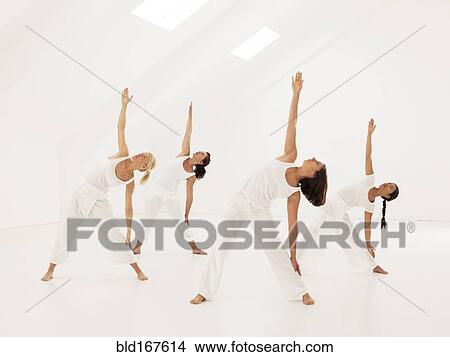 Women practicing yoga in class View Large Photo Image Picture - Women practicing yoga in class. Fotosearch