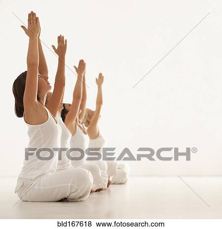 Women practicing yoga in class View Large Photo Image Stock Photo - Women practicing yoga in class. Fotosearch