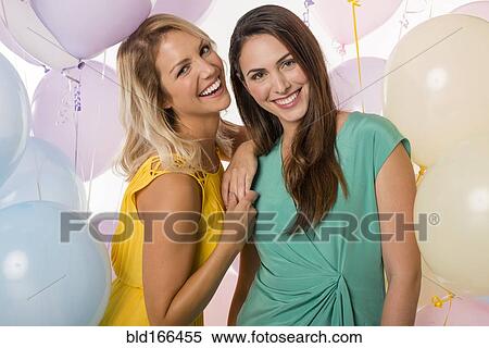 Women smiling with balloons View Large Photo Image Stock Photography - Women smiling with balloons. Fotosearch