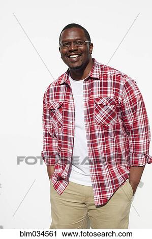 Black man standing with hands in pockets View Large Photo Image Stock Image - Black man standing with hands in pockets. Fotosearch