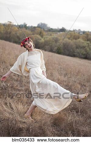 Bride walking on rural hillside View Large Photo Image Stock Image - Bride walking on rural hillside. Fotosearch