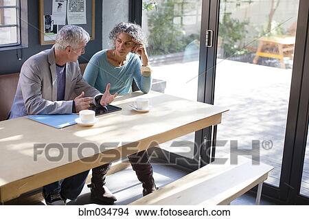 Picture - Business people talking in office meeting. Fotosearch