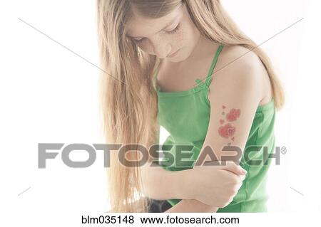 Caucasian girl with temporary tattoo on arm View Large Photo Image Stock Photo - Caucasian girl with temporary tattoo on arm. Fotosearch