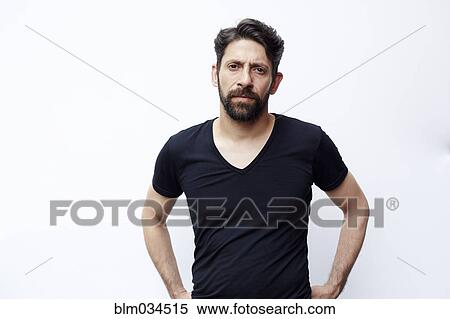 Caucasian man standing with hands on hips View Large Photo Image Stock Photography - Caucasian man standing with hands on hips. Fotosearch