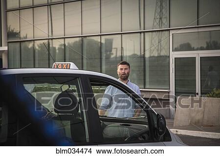 Caucasian man walking towards taxi View Large Photo Image Picture - Caucasian man walking towards taxi. Fotosearch