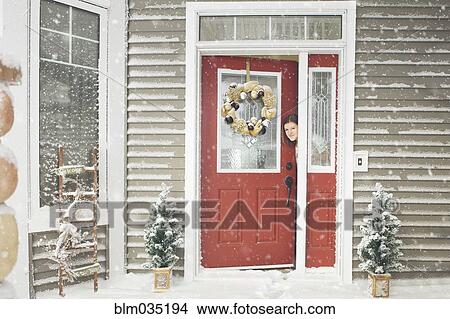 Caucasian woman opening door to snow View Large Photo Image Picture - Caucasian woman opening door to snow. Fotosearch