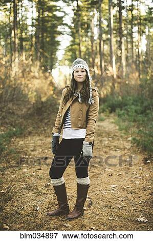 Caucasian woman standing in park View Large Photo Image Stock Photo - Caucasian woman standing in park. Fotosearch
