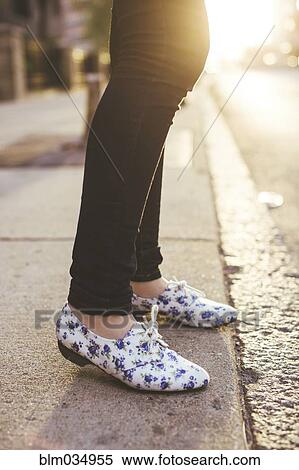 Caucasian woman wearing patterned shoes on city sidewalk View Large Photo Image Stock Photography - Caucasian woman wearing patterned shoes on city sidewalk. Fotosearch