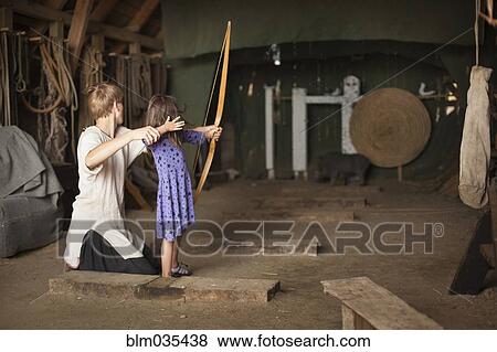 Children practicing archery with target View Large Photo Image Stock Photo - Children practicing archery with target. Fotosearch