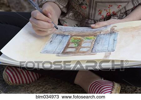 Stock Image - Close up of Caucasian girl drawing. Fotosearch