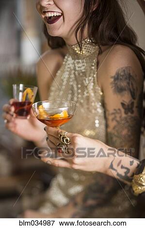 Close up of Caucasian women drinking cocktails View Large Photo Image Stock Photo - Close up of Caucasian women drinking cocktails. Fotosearch