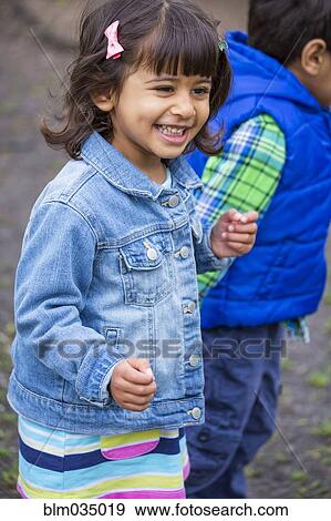 Stock Photo - Close up of children walking outdoors. Fotosearch