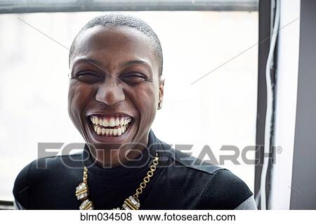 Close up of mixed race woman laughing, View Large Photo Image Stock Photo - Close up of mixed race woman laughing, . Fotosearch