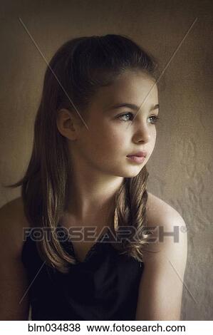 Stock Photo - Close up of serious Caucasian girl. Fotosearch
