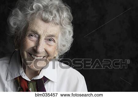Close up of smiling older woman View Large Photo Image Stock Photo - Close up of smiling older woman. Fotosearch