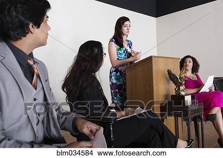 Picture - Debate team speaking on stage. Fotosearch