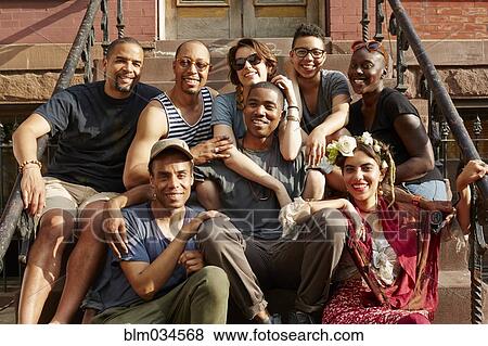 Friends smiling on front stoop View Large Photo Image Stock Photo - Friends smiling on front stoop. Fotosearch