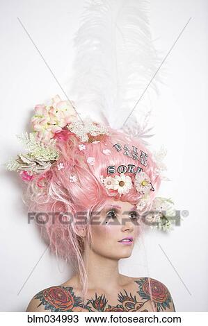 Stock Image - Glamorous woman with flowers in hair. Fotosearch