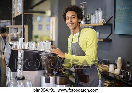 Mixed race barista working in coffee shop View Large Photo Image Stock Photography - Mixed race barista working in coffee shop. Fotosearch